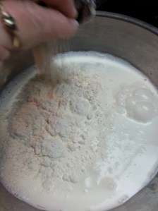 Flour being added to the cream....