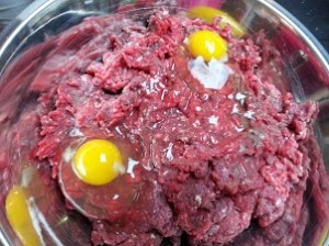 Eggs and ground meat. The white by the egg is just a reflection. Nothing freaky going on with the egg. I promise...