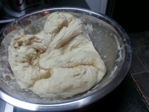 My kids favorite part. Punching down the dough...