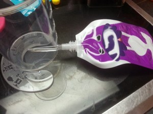 Pouch tip slides onto the filler...