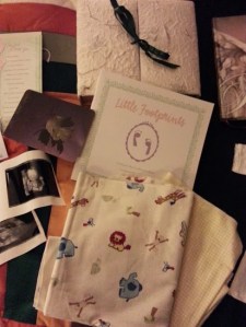 His keepsake box, his baby blankets that I used to design his nursery, hand and foot prints in the book...