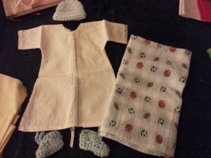 Outfit they put him in after they cleaned him up and the baby blanket they wrapped him in...