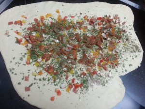 Pizza toppings on the crust....