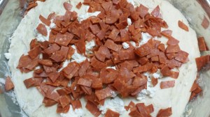 Dough with pepperoni....